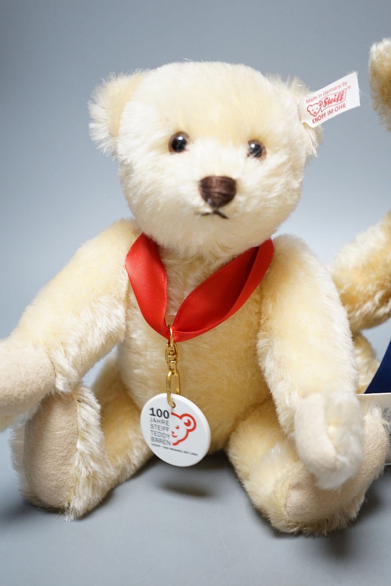 A Side-To-Side Steiff bear, white label, 35cm, box / certificate, together with an Anniversary Bear Box 25cm. a Steiff Bunny Campione bear with box and certificate, 28cm